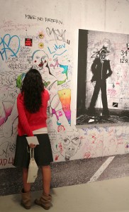 Girl writing on wall - Mike Hope